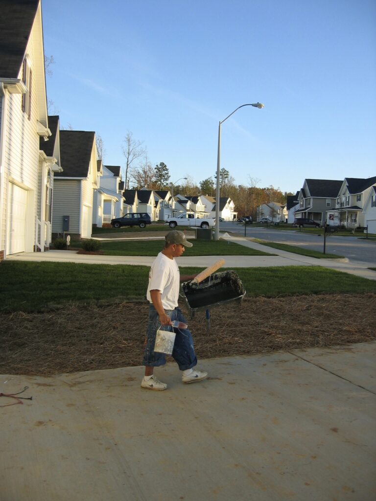 Enrique finishes a day of painting houses in North Carolina.[Credit: Sonia Nazario]