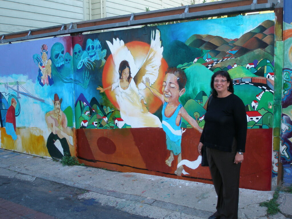 Sonia Nazario visiting Josue Rojas' mural in San Francisco's Balmy Alley.